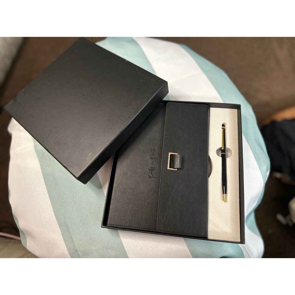 Black leather journal with pen